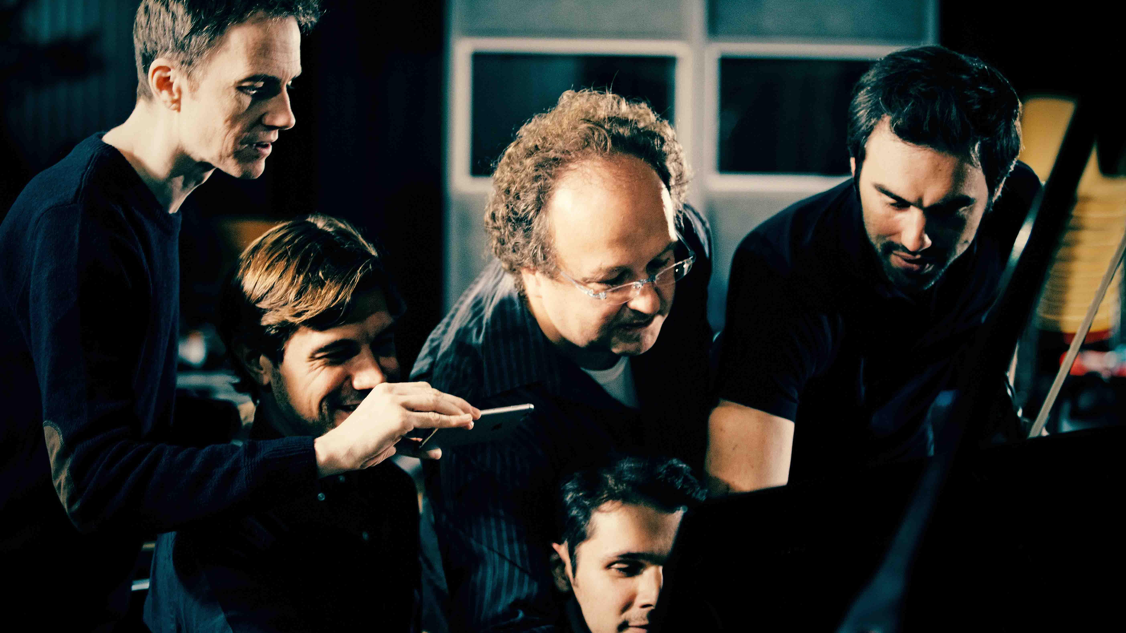 Guillaume Sutre in the studio with several others