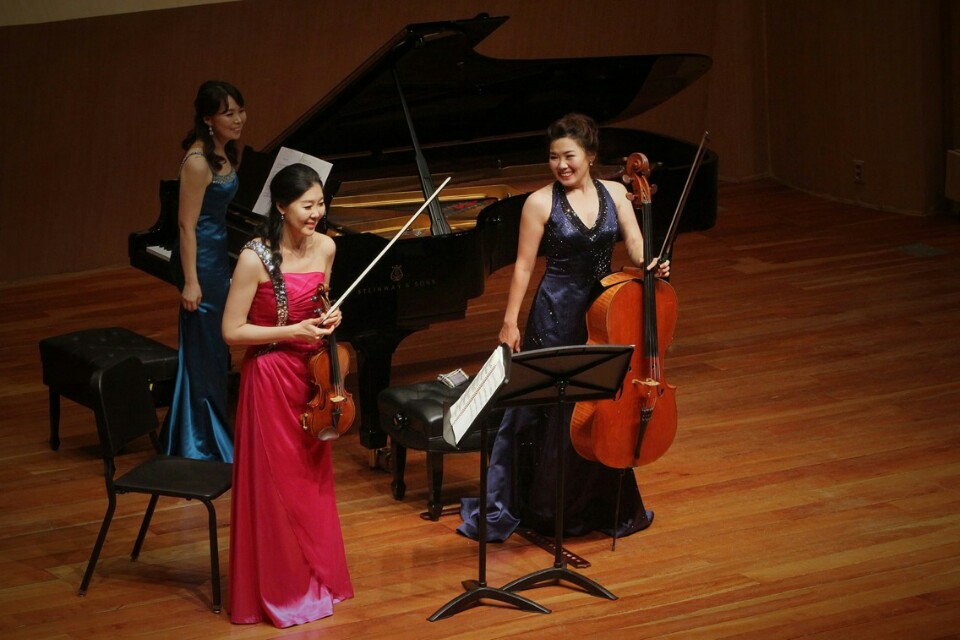 Yeonjin Kim with her sisters performing as K Trio